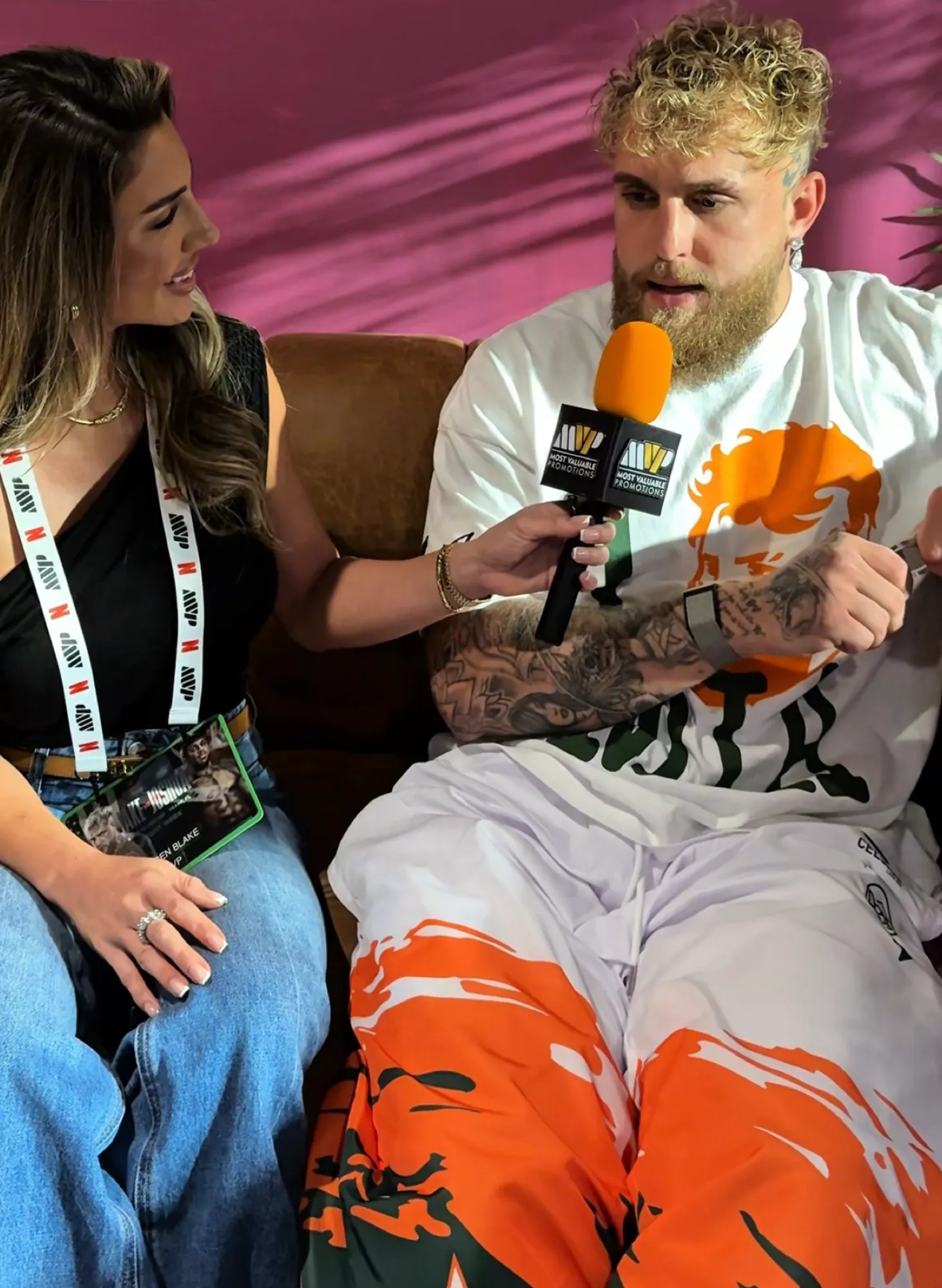 Lauren interviewing Jake Paul with a Most Valuable Promotions microphone.